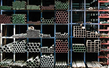 Image showing Pipes stacked up in a factory 