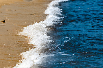 Image showing Blue waves reaching the shores of a beach