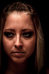 Image showing Photo of a young woman against dark background