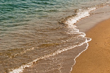 Image showing Coastal line with water and sand at the ocean