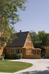 Image showing Front of a House and its Driveway with Blue Skies on the Backgro