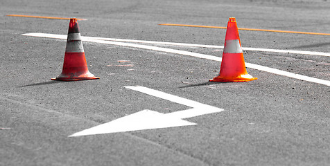 Image showing Road block with white arrow showing the alternate way