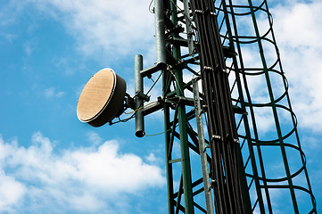 Image showing Communication tower against blue sky with clouds