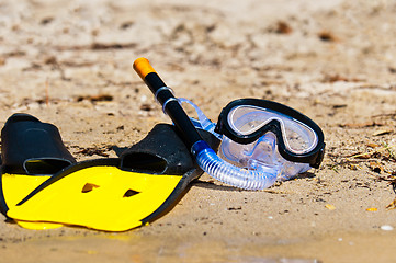 Image showing Goggles and flippers on the beach