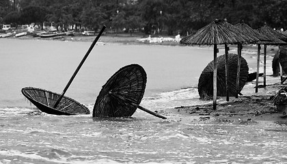 Image showing A dirty polluted beach  in the rain