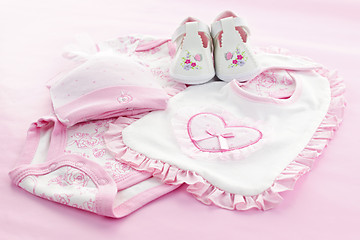 Image showing Pink baby clothes for infant girl