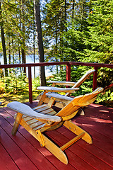 Image showing Forest cottage deck and chairs