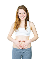 Image showing Smiling girl with hands on tummy