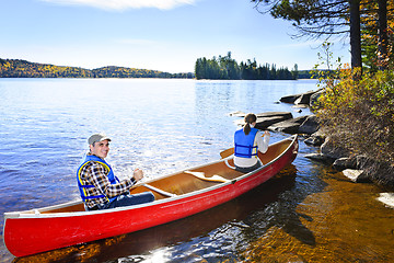 Image showing Canoeing near lake shore