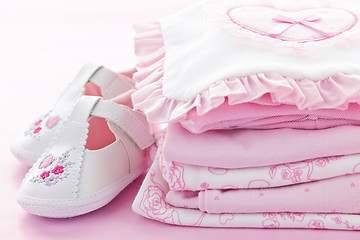 Image showing Pink baby clothes for infant girl