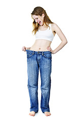 Image showing Happy girl in jeans after losing weight