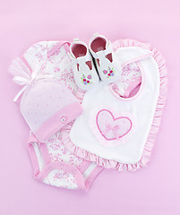 Image showing Pink baby clothes for infant girl