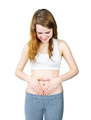 Image showing Teenage girl with hands on tummy