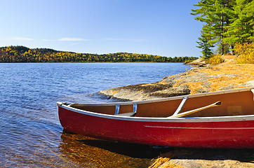 Image showing Red canoe on shore