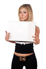 Image showing Surprised blonde holding white board