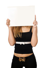 Image showing Woman covering her face with white board