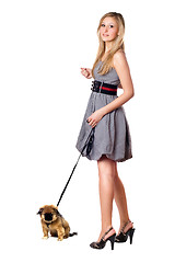 Image showing Blonde walking over her puppy