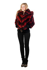 Image showing Pretty woman posing in fur jacket. Isolated