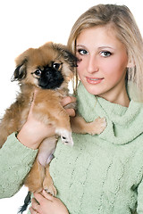 Image showing Pretty blonde with a pekinese