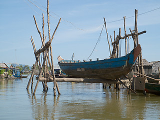 Image showing Boat repair shop at floating village on Tonle Sap