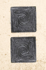 Image showing metal spiral motivs on recycled paper 