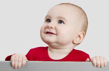 Image showing young child holding sign