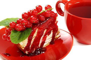 Image showing Crepe cake and a red cup of tea.