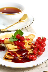 Image showing Pancakes with berry sauce.