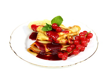 Image showing Pancakes with berry sauce.