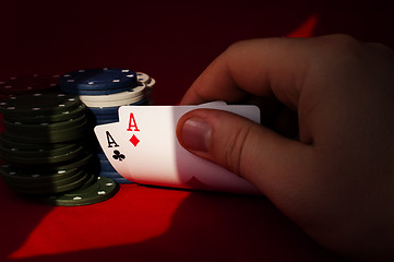 Image showing Two aces high on red table with chips