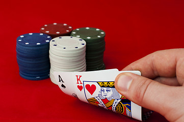 Image showing Ace adn King high on red table and chips