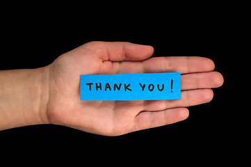 Image showing Frase Thank You on paper and hand