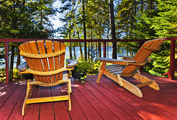 Image showing Forest cottage deck and chairs