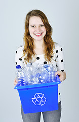 Image showing Young woman with recycling box