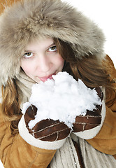 Image showing Playful winter girl holding snow