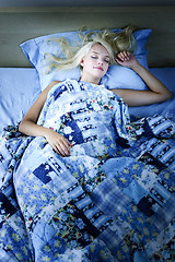 Image showing Woman sleeping in bed at night