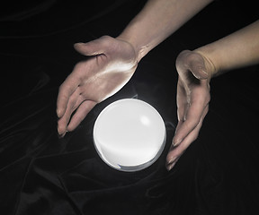 Image showing crystal ball and hands around