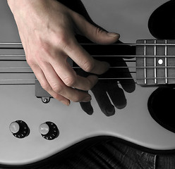 Image showing hand on bass guitar