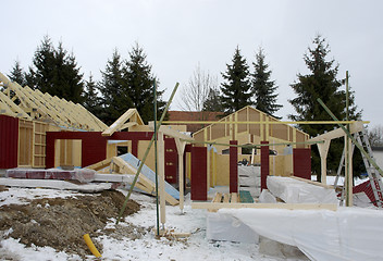 Image showing wooden house construction at winter time