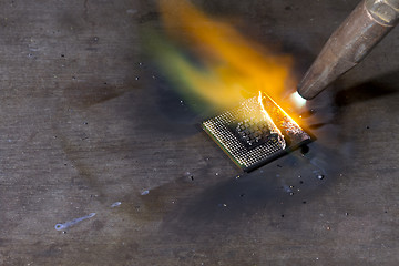 Image showing welding torch and cpu