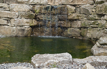 Image showing stone wall and pond detail