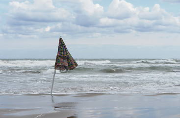 Image showing closed sunshade and deserted beach