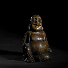 Image showing Buddha sculpture in dark back