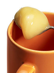 Image showing cup and honey spoon