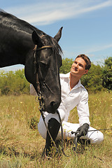 Image showing young man and horse