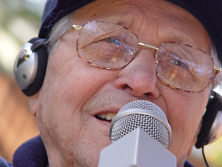 Image showing An old man singing