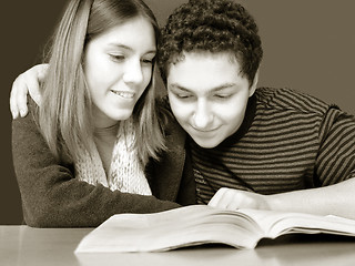 Image showing 2 teenagers reading a book