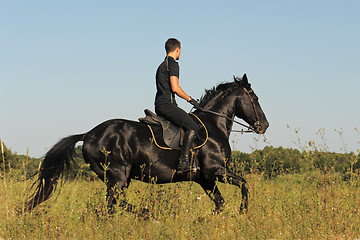 Image showing young man and horse