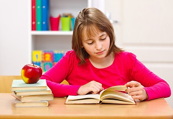 Image showing Schoolgirl reading book