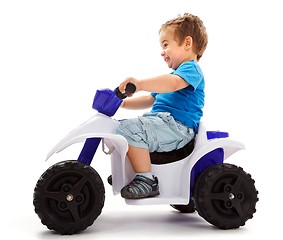 Image showing Little boy going fast with quad